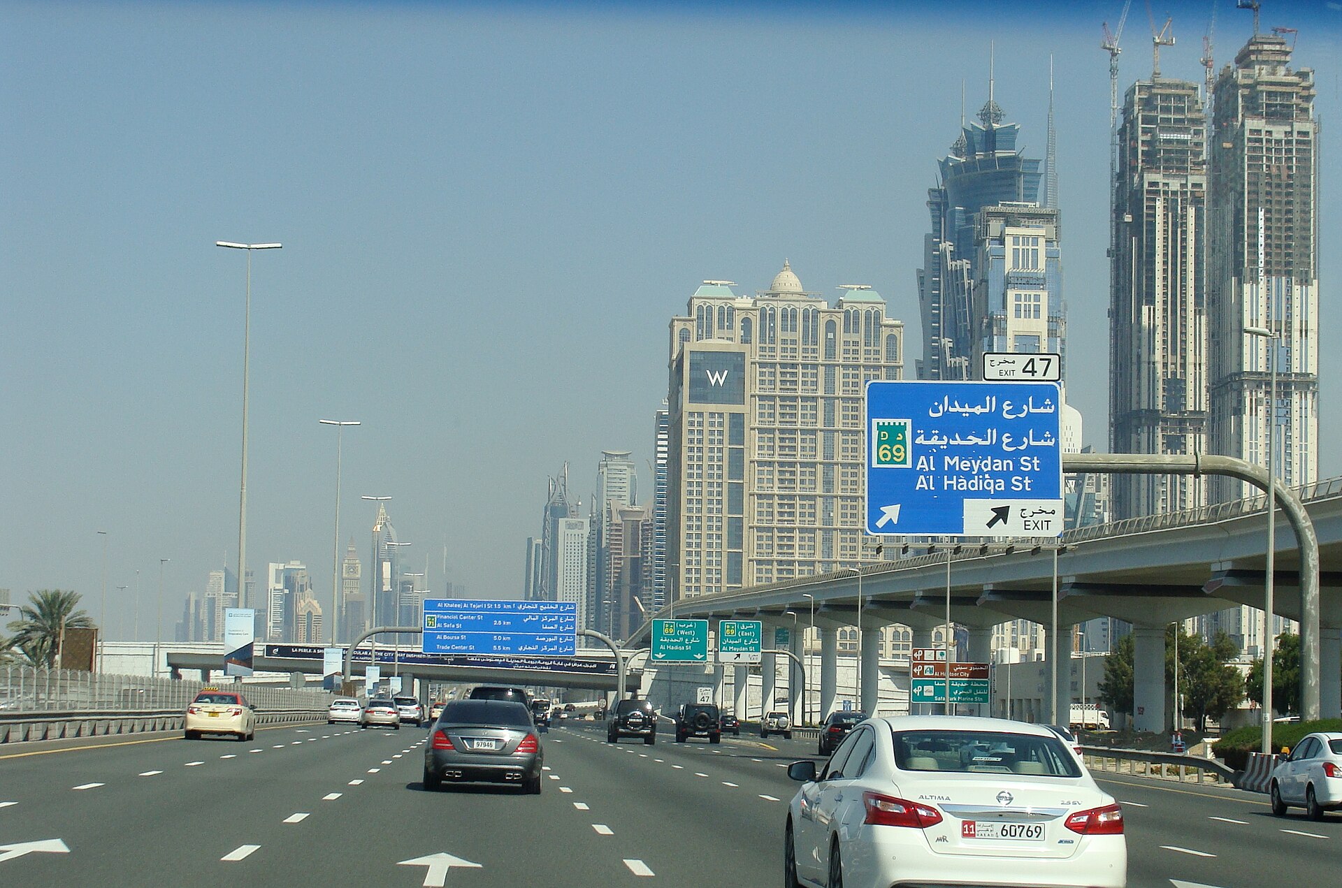 UAE highway stretching through desert landscape at golden hour